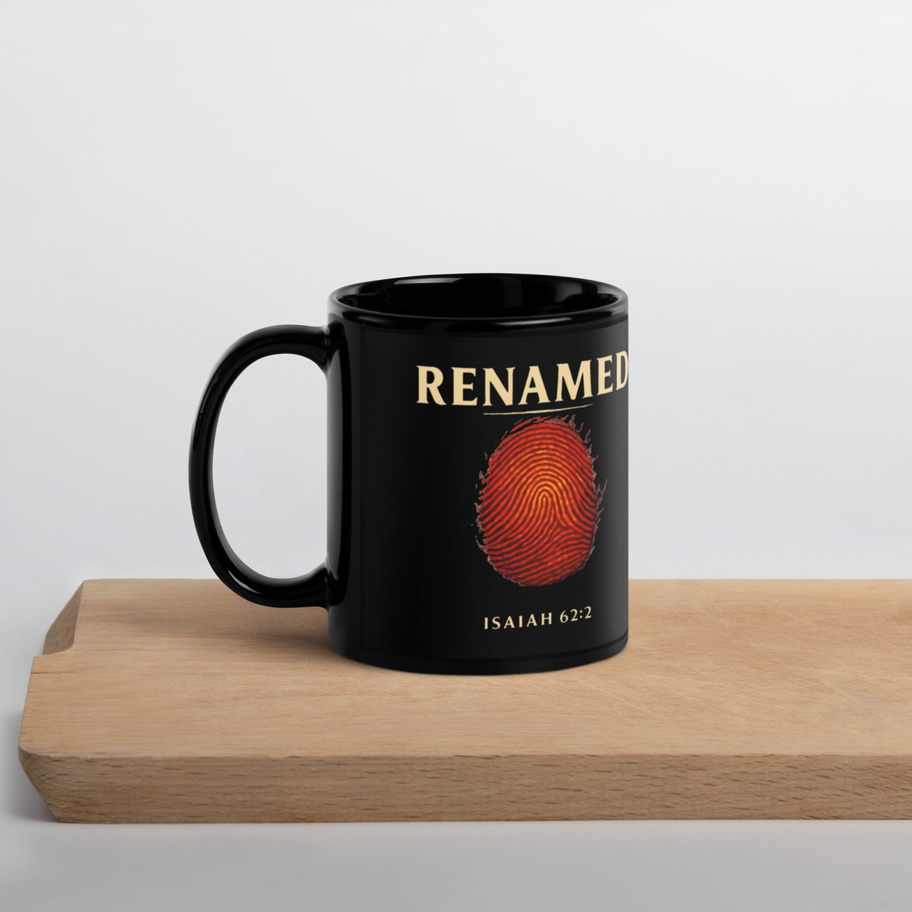 Renamed Black Glossy Mug 11oz front side showing fingerprint design in gold on matte black ceramic