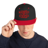 Man wearing black and red Christian snapback – bold Marked by Stripes design with flat bill style