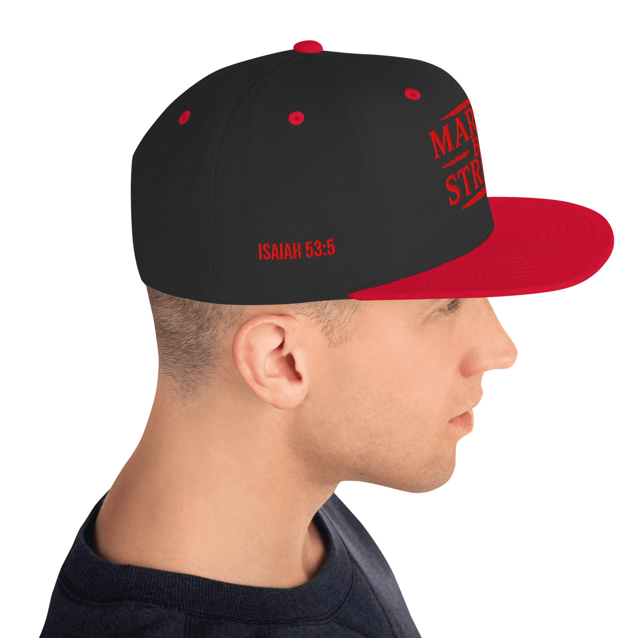 Man wearing black and red Christian snapback standing to the right – bold Isaiah 53:5 embroidered in red on right side