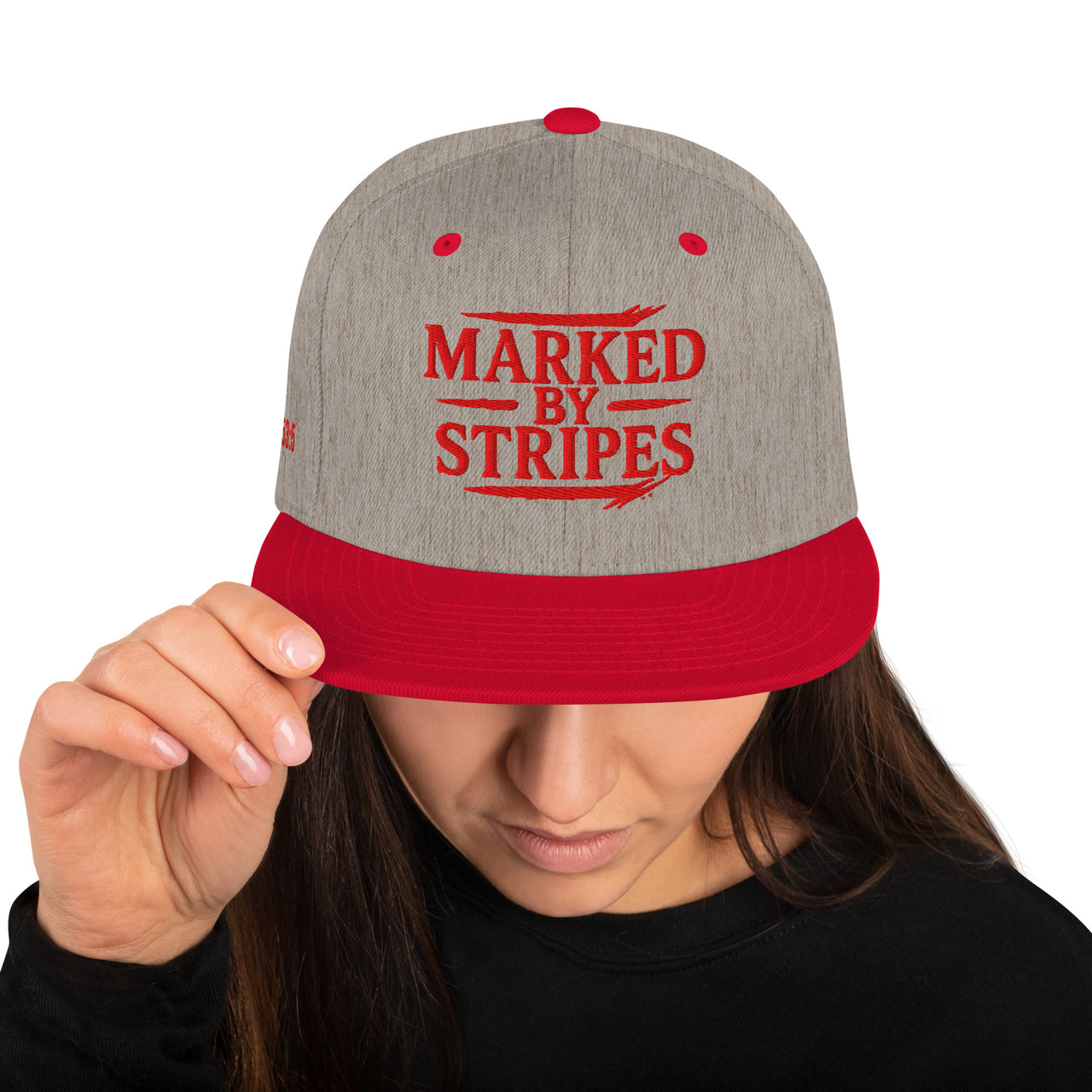 Woman wearing heather grey and red gospel snapback – front view with bold Christian embroidery