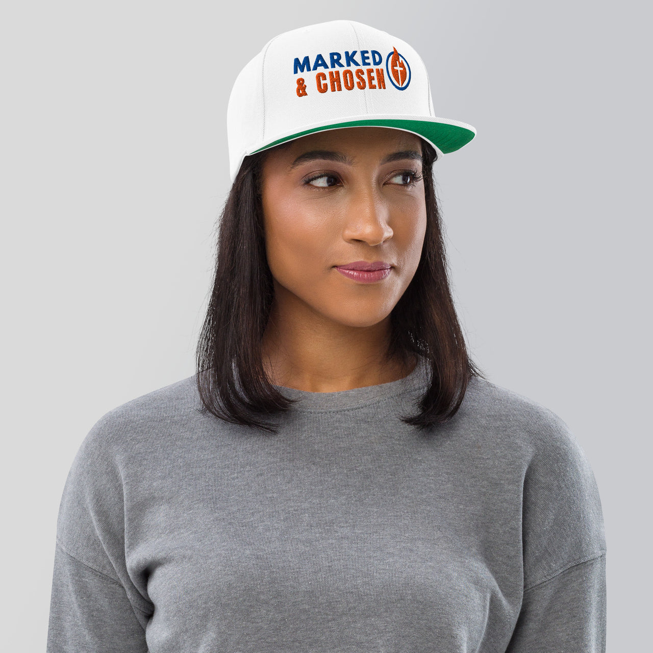 Woman wearing white Marked & Chosen snapback – bold Christian embroidery on flat bill cap