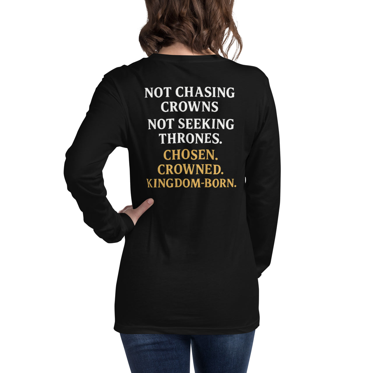 Female model in black gospel long sleeve shirt – back reads “Not Chasing Crowns. Not Seeking Thrones. Chosen. Crowned. Kingdom-Born.”