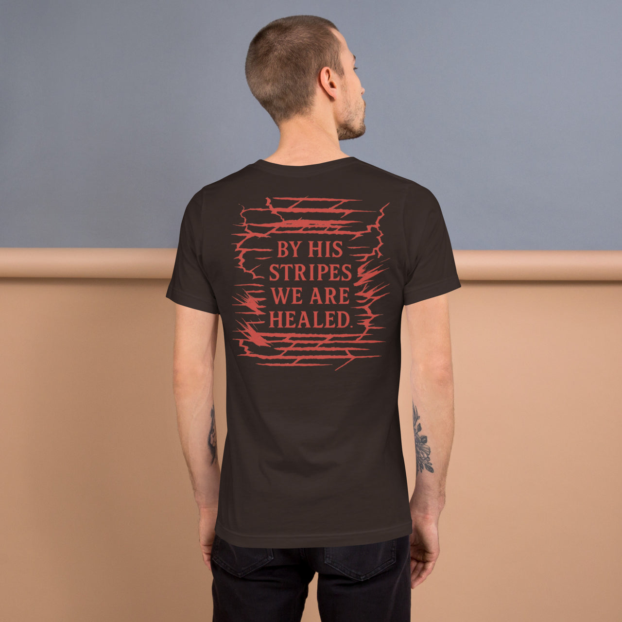 Male model showing brown Christian shirt – bold Isaiah 53:5 design across the back