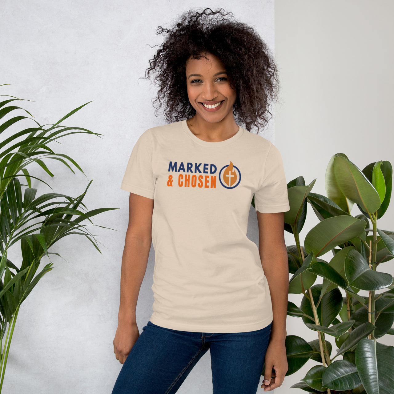 Woman in cream gospel t-shirt – clean front logo on neutral-tone shirt