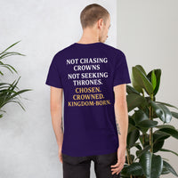 Male model in team purple Christian shirt – back print of Not Chasing Crowns. Not Seeking Thrones. Chosen. Crowned. Kingdom-Born.
