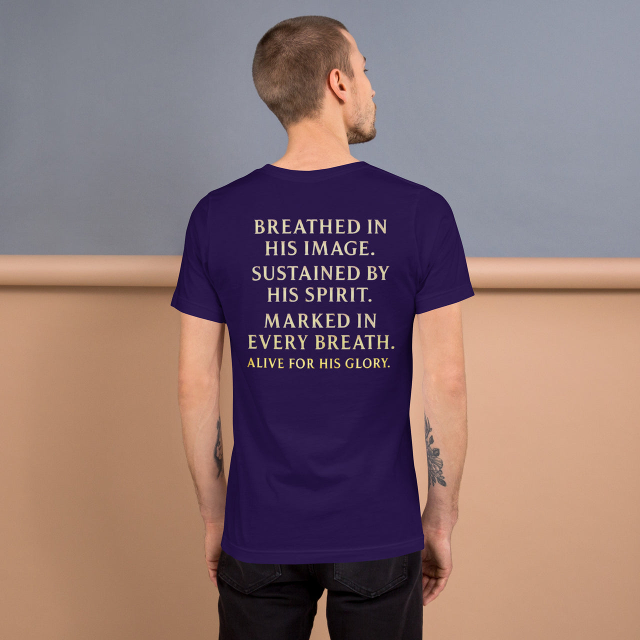 Male model wearing My Breath Bears His Name T-Shirt in Team Purple, back word stack design