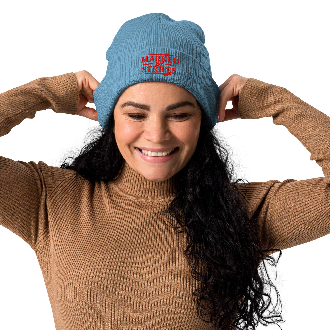 Woman wearing light blue Marked by Stripes beanie – red gospel embroidery on cuff
