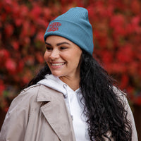 Side angle of woman in light blue Christian hat – Isaiah 53:5 beanie with clean red stitching