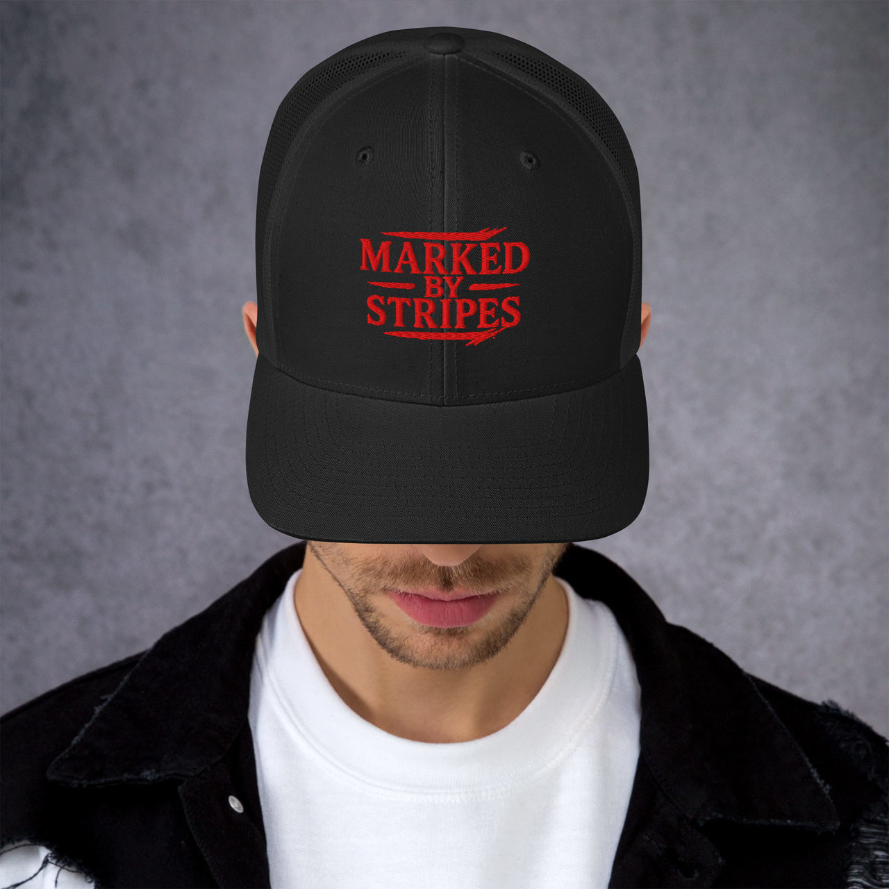 Man wearing black Marked by Stripes snapback – bold gospel embroidery and mesh cap design
