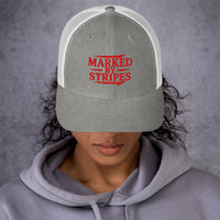 Woman wearing heather grey and white Christian trucker hat – red Marked by Stripes embroidery front view