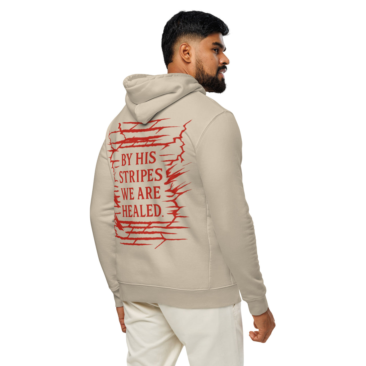 Man wearing desert dust Christian hoodie – red By His Stripes We Are Healed visible on the back