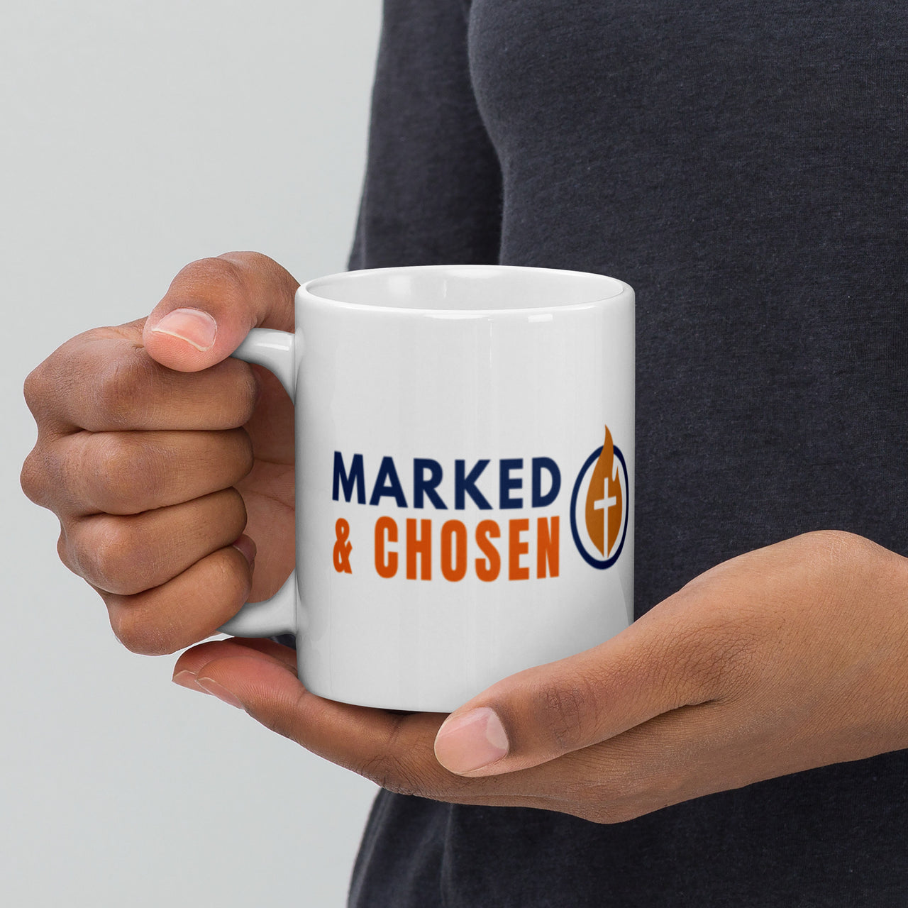 Model holding 11oz Marked & Chosen white mug – Christian logo side facing forward