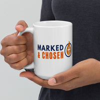 Model holding 15oz Marked & Chosen mug – white glossy finish with bold Christian logo