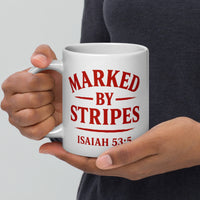 Model holding large 20oz Marked by Stripes mug – red gospel logo facing camera